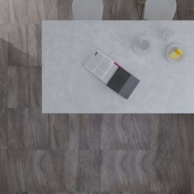 Top-down view of a modern dining area featuring gray wood-look plank flooring and a white rectangular table with a book and small dishes.

Torlys EverTile™ Premier Cenere Grey Luxury Vinyl, a wide plank, low sheen floor available at Alberta Hardwood Flooring.