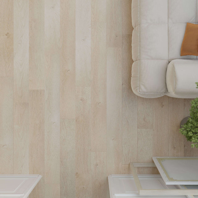 Light beige wood plank flooring shown in a styled room setting with a cream tufted sofa, a small side table, and a potted plant.

Torlys Rigidwood™ Marshland Luxury Vinyl. Wide laminate planks with realistic finishes and unmatched quality, available with install at Alberta Hardwood Flooring.