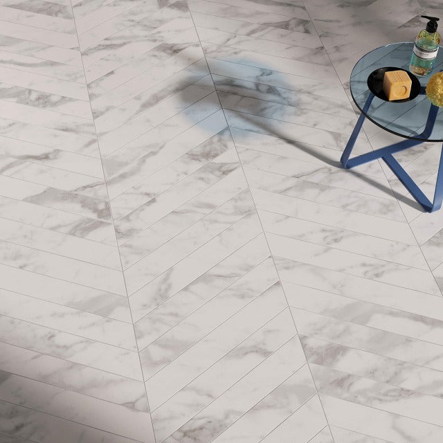 Ames Roma Chevron Matte Floor and Wall Tile, available at&amp;nbsp; Alberta Hardwood Flooring. &amp;nbsp;Visit one of our showrooms to view in person, and to obtain pricing for this product.&amp;nbsp;  Stone inspired porcelain in a stunning chevron format. This collection offers 3 options : Calacatta, Graphite, and Carrera.&amp;nbsp;