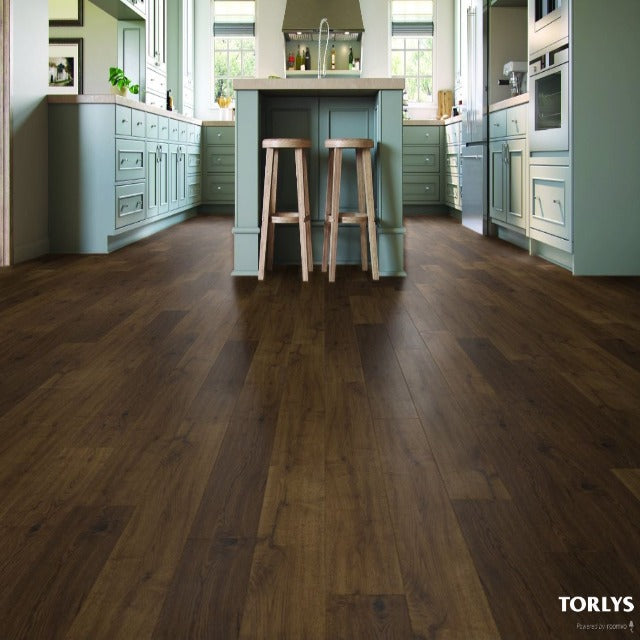 Torlys Styleo Campfire Oak Laminate, a rustic, wide plank dark surface, available at Alberta Hardwood Flooring.