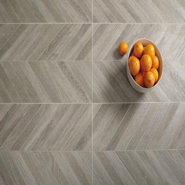 Daltile 18" X 36" Trellis Oak  Deco Chevron Smoke, available with install, at Alberta Hardwood Flooring.