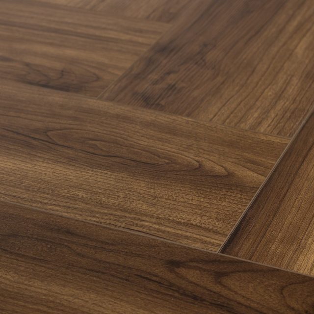 Evoke VCC Vivid Herringbone Andrew, a brown, embossed, wide plank in a low gloss finish, available at Alberta Hardwood Flooring.