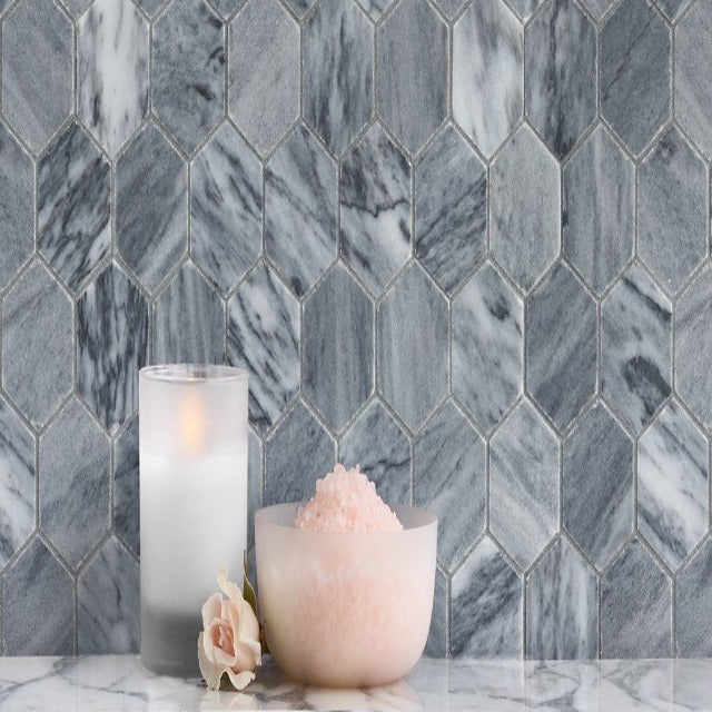 Ann Sacks Catia Grey Honed Marble, available with install, at Alberta Hardwood Flooring.  Hailing from Portugal, Catia Grey is a dramatic grey marble with a unique coloration and veining pattern that adds impact to any room. This product is available in a Mosaic, and 2 large formats.