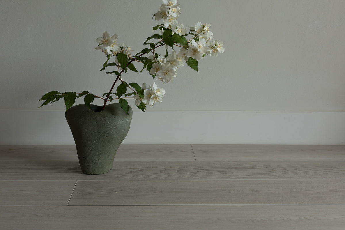 Mackenzie, from the Ethos Legacy WPC LVP Luxury Vinyl Plank collection, available at Alberta Hardwood Flooring.  Bring the beach to you with this stone-washed, light flooring. With waterproof floorboards, the clean, organic aesthetic will look brand new for years to come.
