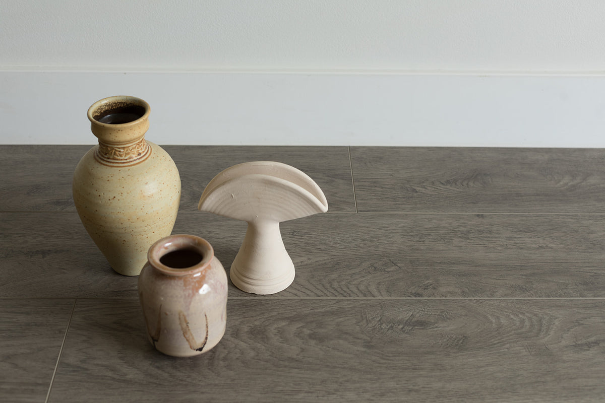 Paisley, from the Ethos Legacy WPC Luxury Vinyl Plank LVP collection, available at Alberta Hardwood Flooring.   Make your design choices easy with this neutral option that complements almost any space. This flooring is perfect for the minimalist or pairing with a dramatic flair.