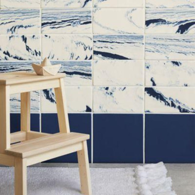 Ann Sacks Shaye Porcelain Wall TIle, available with install, at Alberta Hardwood Flooring.  Shaye, a series of marbled and standard field tiles inspired by the swirls of Old World Florentine paper design, joins Ann Sacks porcelain tile offerings. Shaye, offered in four marbled and five standard color options, will create an illusionary wall and floor application of elegant distinction.