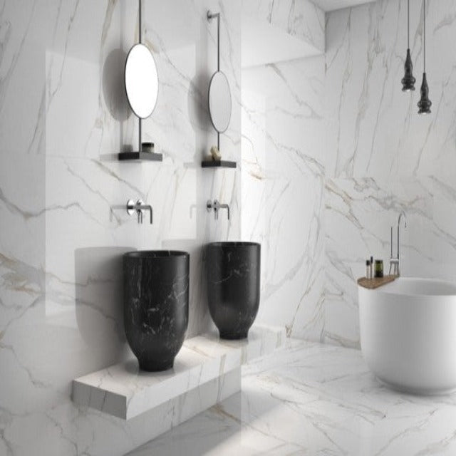 Tierra Sol Aurora Calcutta Gold Natural Rectified 12&quot; x 24, in stock in Edmonton.  Aurora Gold is a refined Calacatta Gold, one of the most prestigious stones in the world. This type of marble can coexist in classic and avant-garde spaces. The contrasting white background combines delicate grey veins with gold reflections that add warmth to the marble finish.